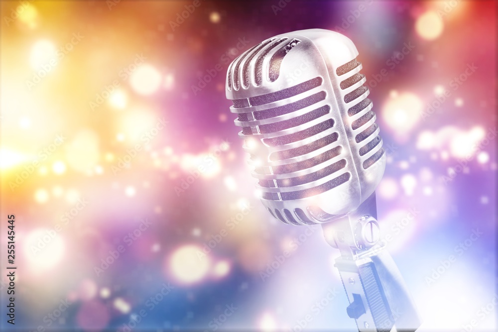 Retro style microphone on abstract background