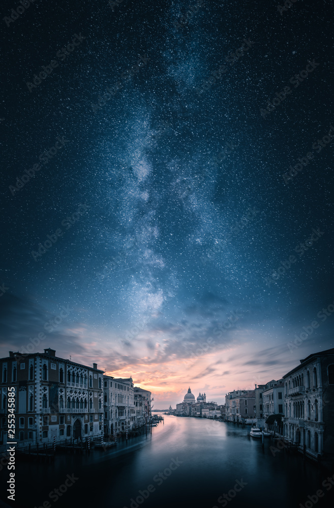 Artistic view of grand canal and Basilica di Santa Maria della Salute in Venice, Italy under majesti