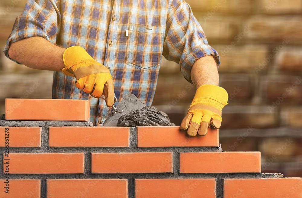 Portrait of young profession man at work on background