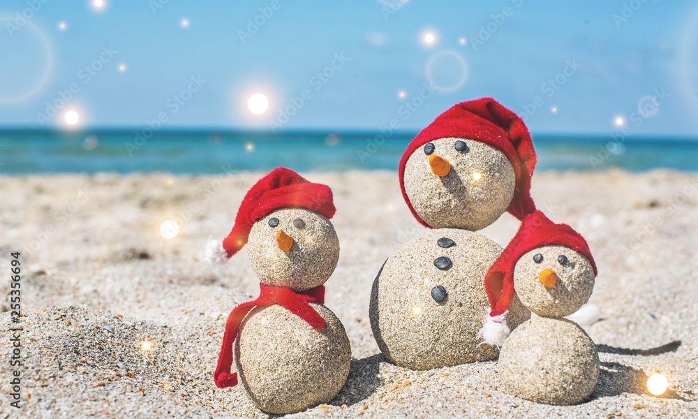 Sandy snowmen. Holiday concept can be used for New Years and Christmas Card