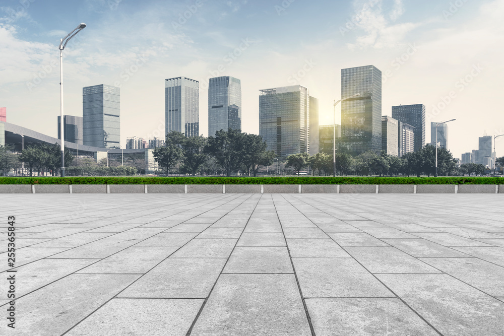 Urban skyscrapers with empty square floor tiles