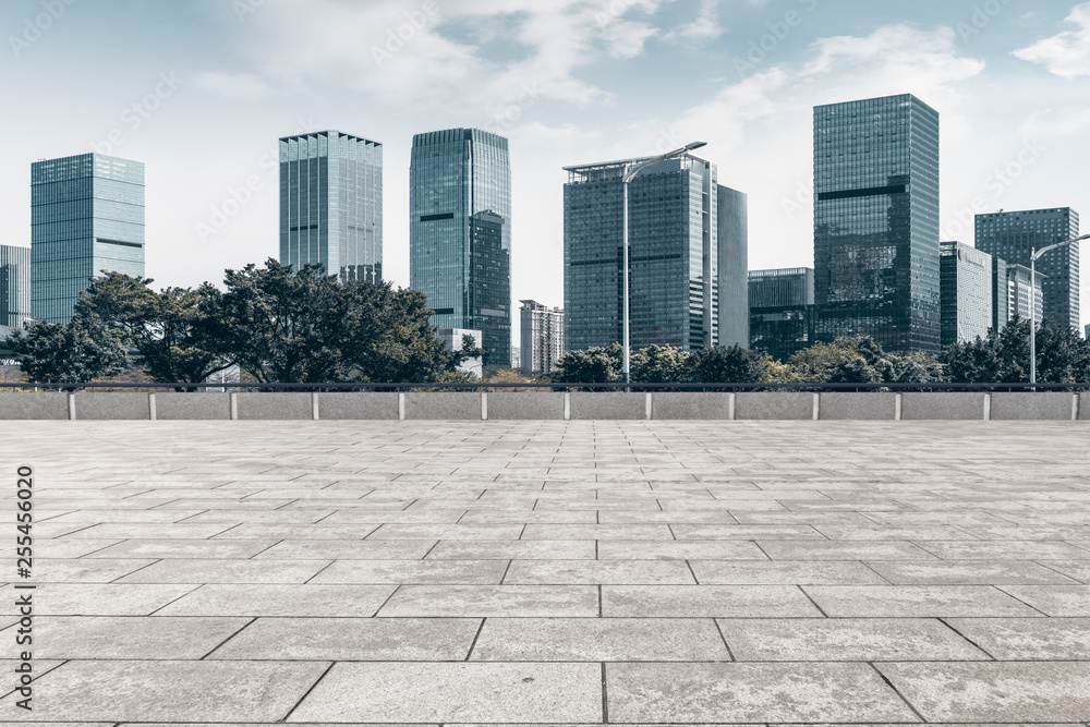 Urban skyscrapers with empty square floor tiles