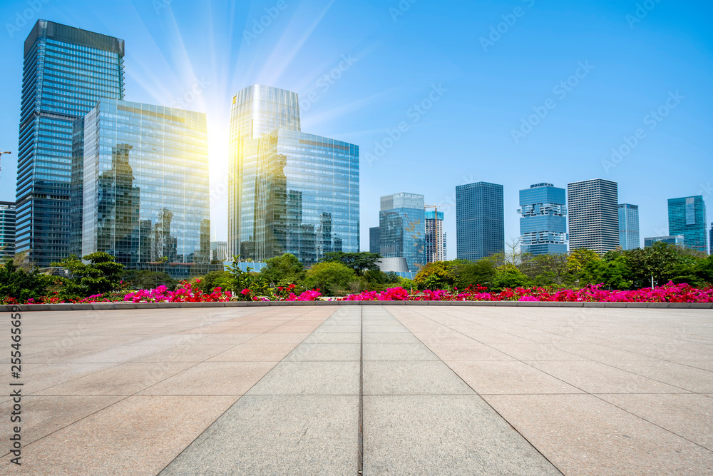 Urban skyscrapers with empty square floor tiles