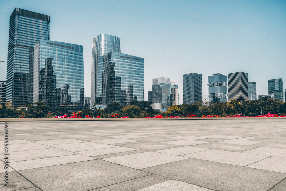 Urban skyscrapers with empty square floor tiles