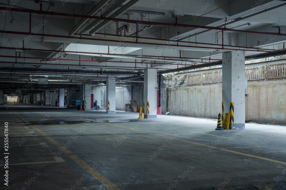 old parking lot with lighting, concrete building