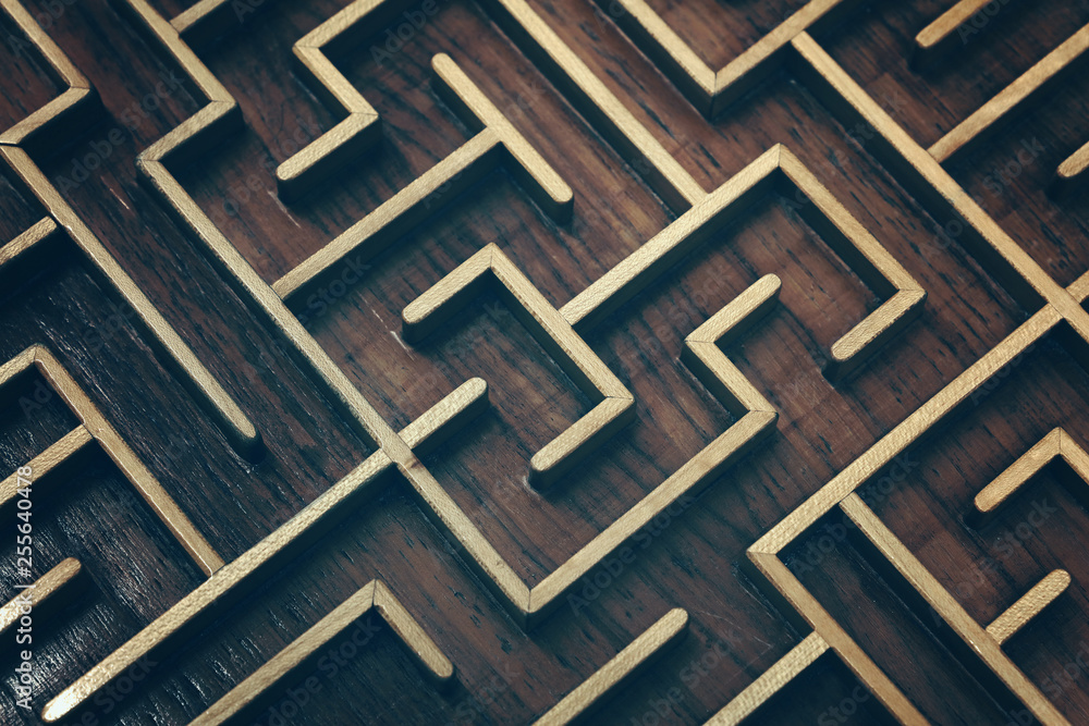 Wooden brown labyrinth maze puzzle close up