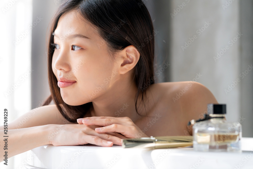 young pretty asian teen woman enjoy relaxing in bathroom morning light freshness feeling moment