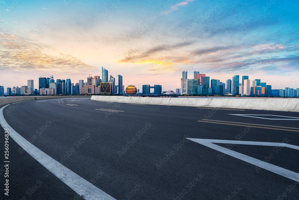 Foreground highway asphalt pavement city building commercial building office building