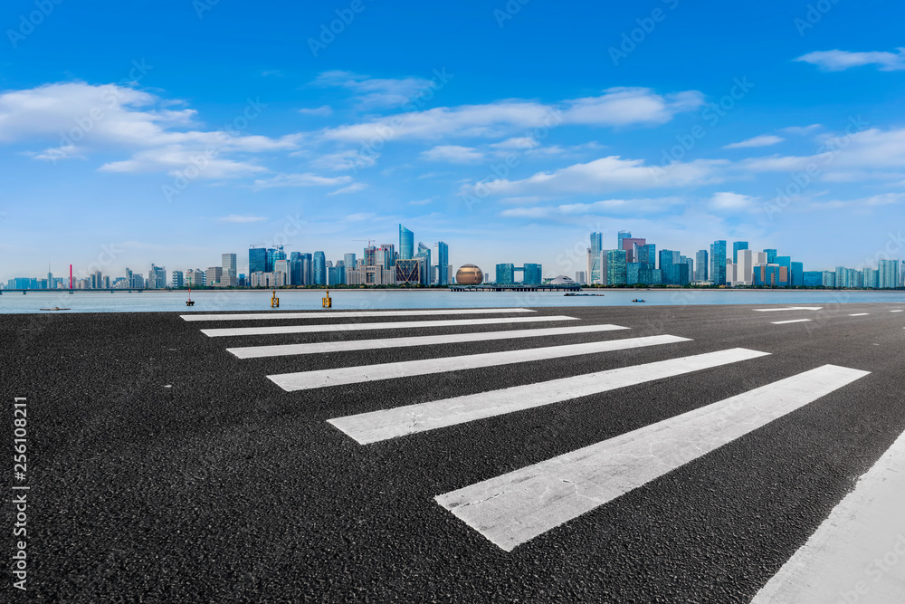 Foreground highway asphalt pavement city building commercial building office building