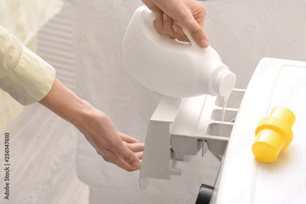 Woman doing laundry at home