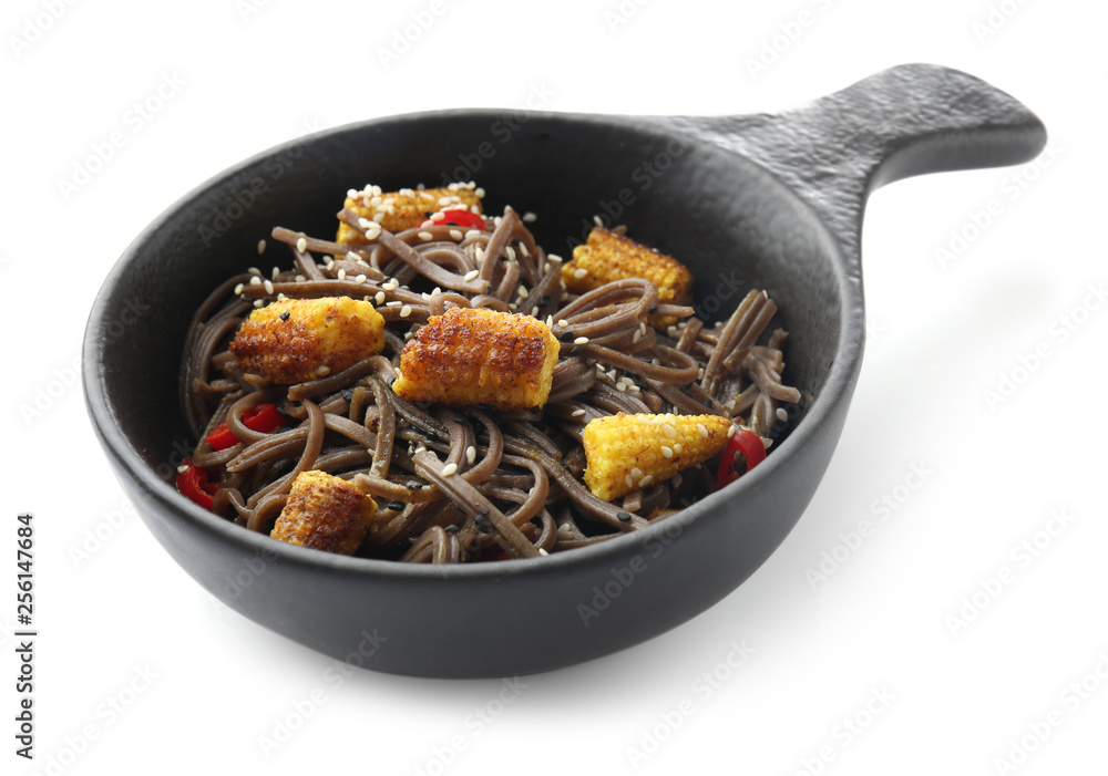 Bowl with tasty soba noodles, corn cobs and chili on white background