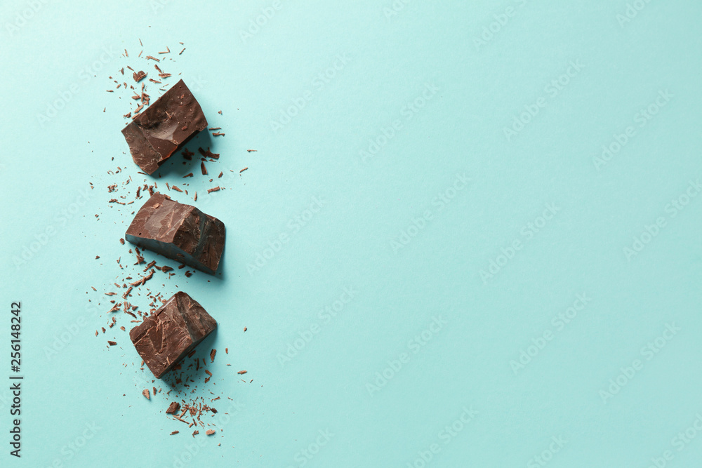 Sweet tasty chocolate on color background