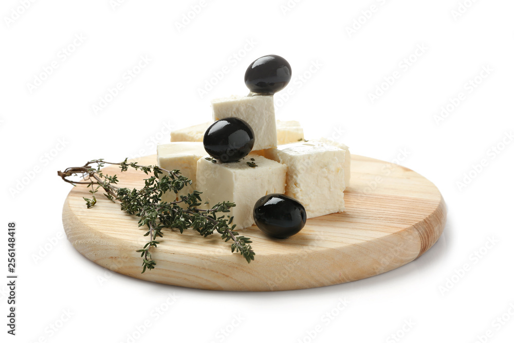 Wooden board with tasty feta cheese and olives on white background