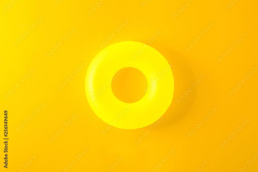 Inflatable ring on color background