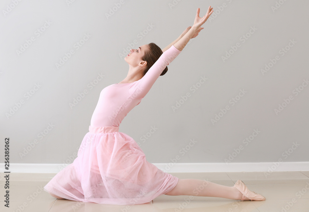 Beautiful young ballerina in dance studio