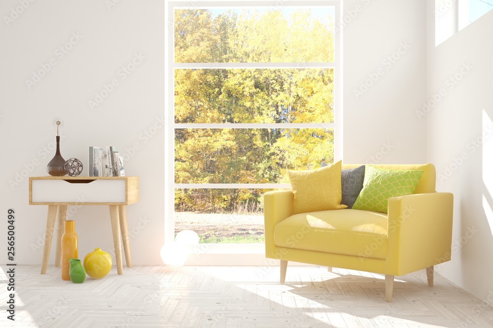 White stylish minimalist room with armchair and autumn landscape in window. Scandinavian interior de