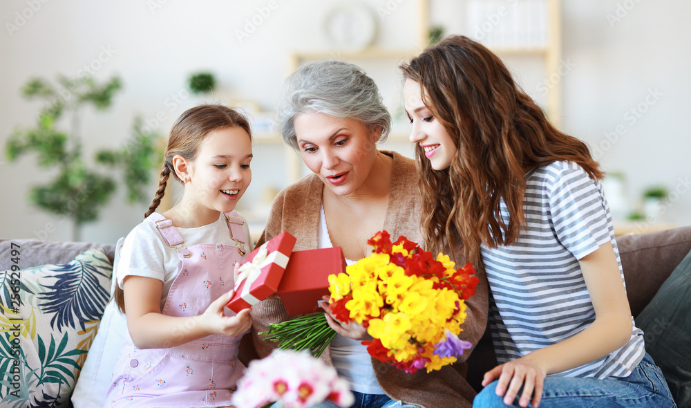 mothers day! three generations of  family mother, grandmother and daughter congratulate on the holi