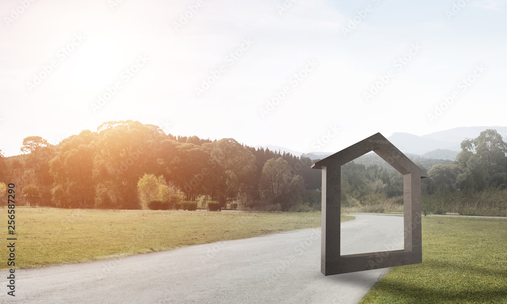 Conceptual background image of concrete home sign on asphalt road