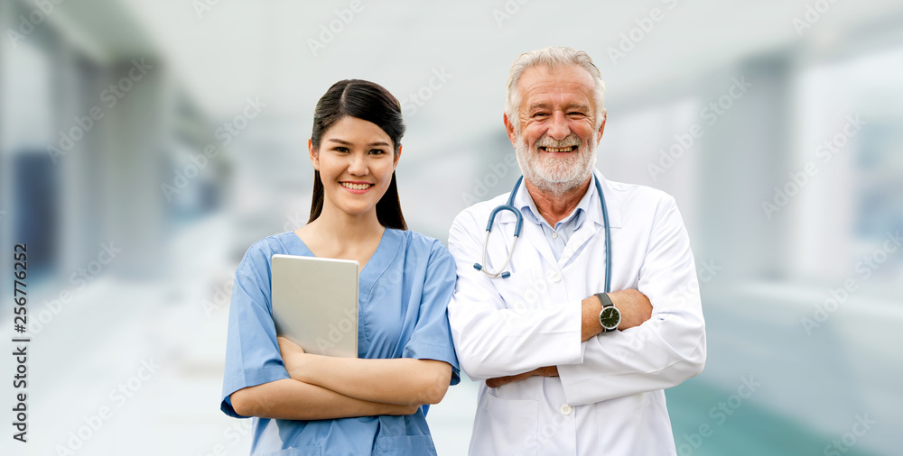 Senior doctor working with young doctor in the hospital. Medical healthcare staff and doctor service