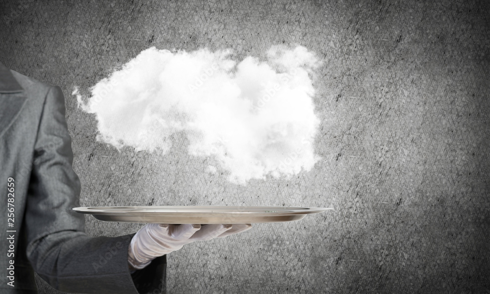 Hand of waitress presenting cloud on tray.