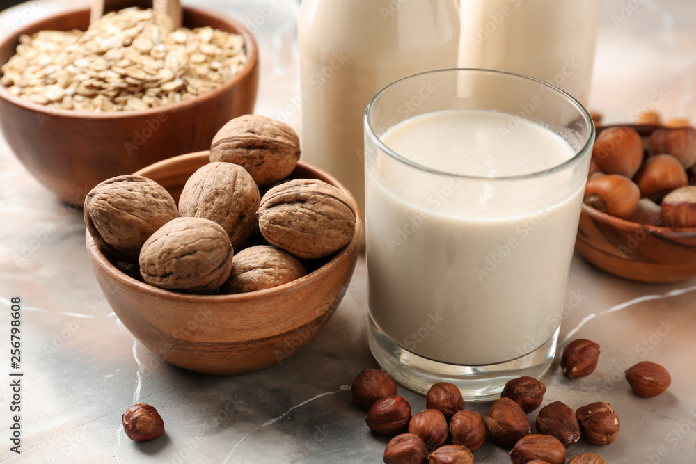 Tasty vegan milk on table