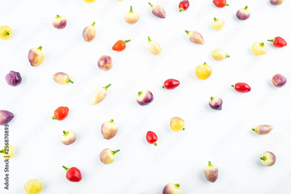 Fresh colorful peppers on white background