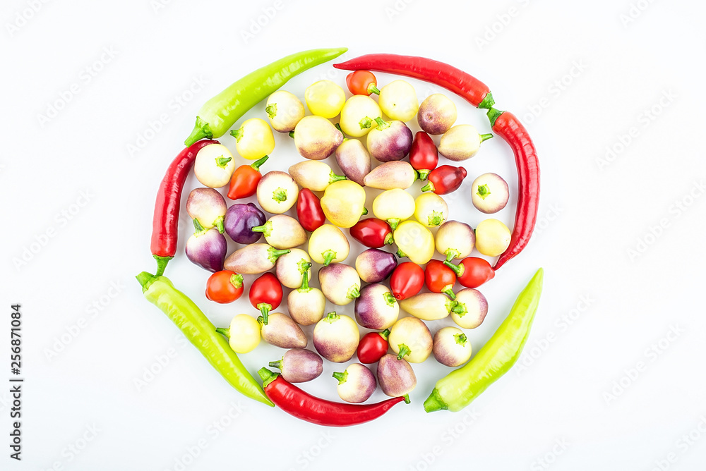 Bunch of fresh colorful peppers on white background