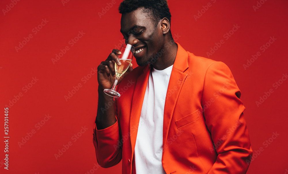 Stylish man having a glass of champagne