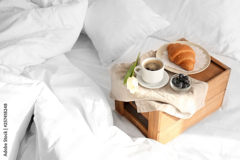 Tasty healthy breakfast on bed