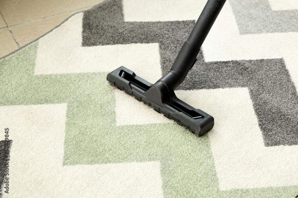 Brush of vacuum cleaner on carpet