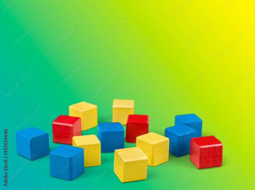 Colorful children building bricks on background