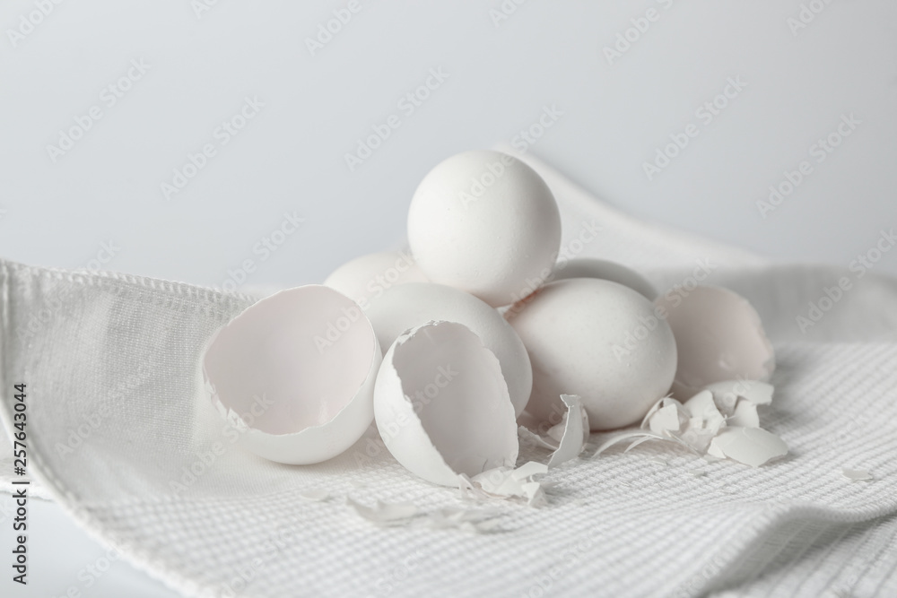 Tasty raw eggs on white napkin