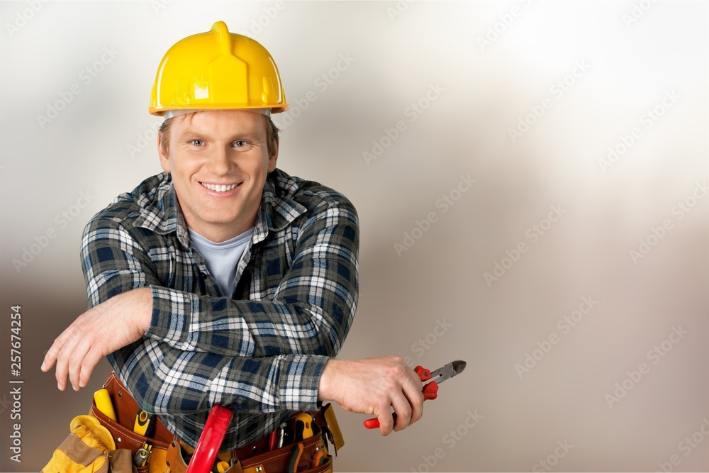 Construction worker with tools in empty building