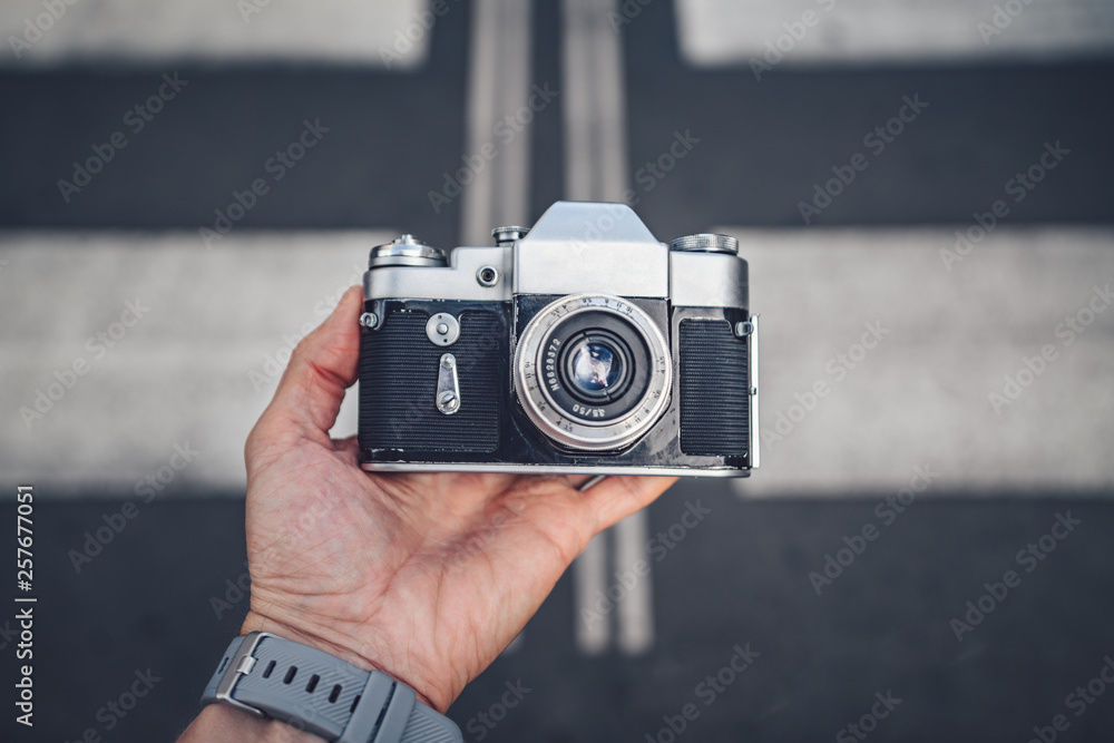 Mens hands with a camera