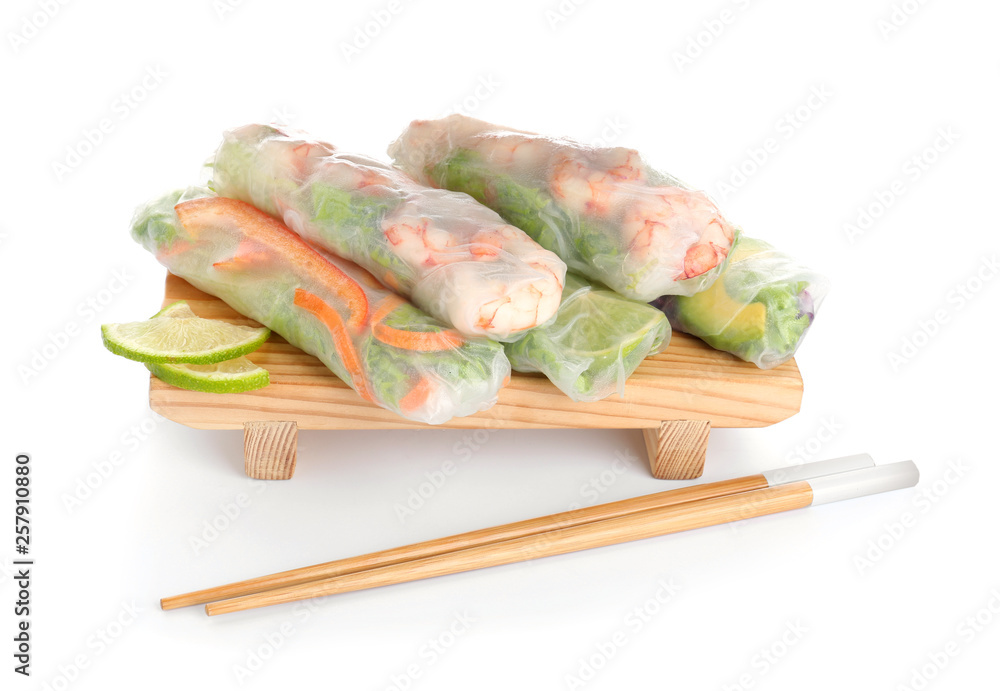 Tasty spring rolls on white background