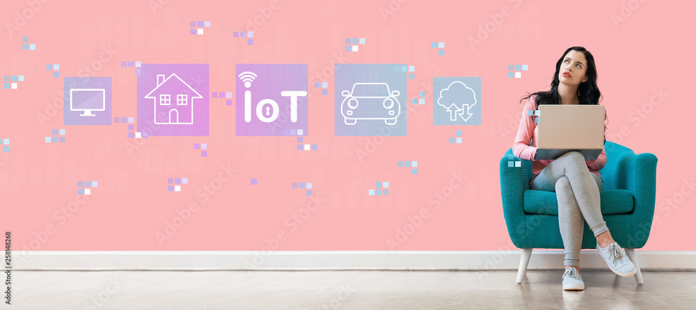 IoT theme with young woman using a laptop computer 