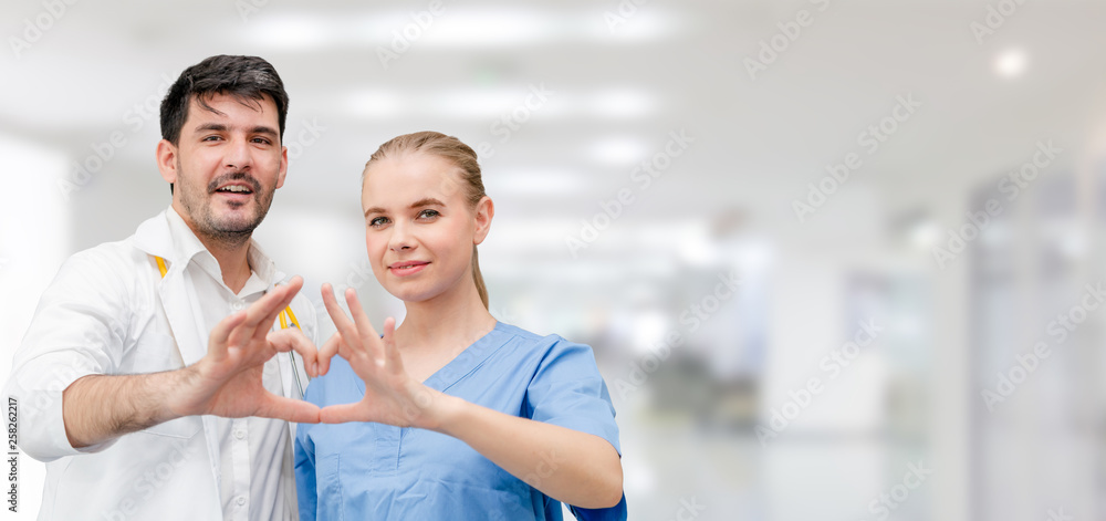 Doctors at hospital office working with another doctor. Healthcare and medical services.