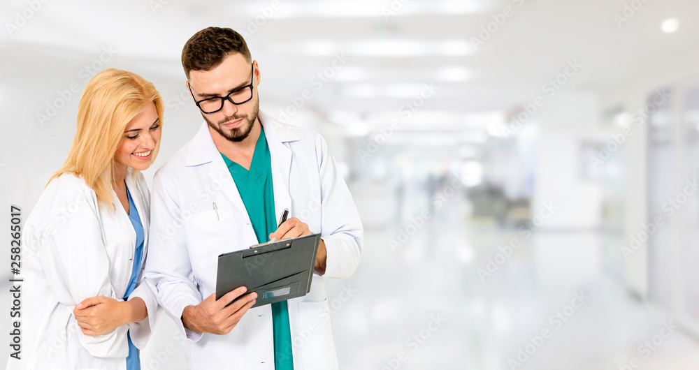 Doctor working with another doctor in the hospital. Healthcare and medical service.