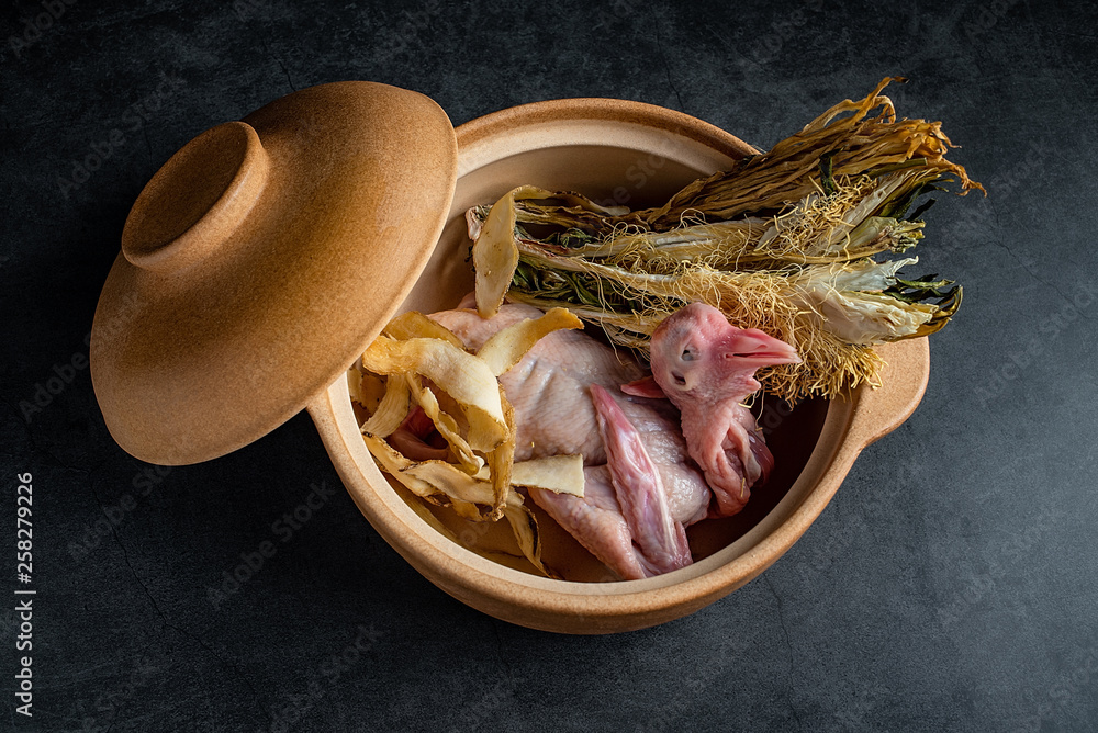 a fresh pigeon and health soup in a casserole