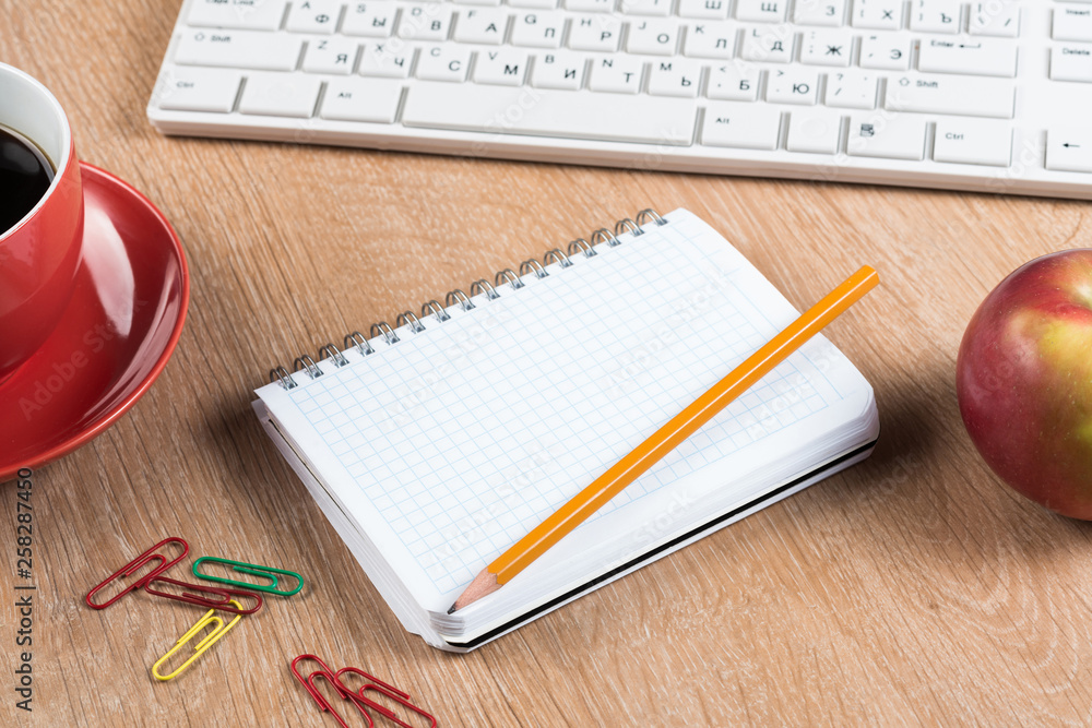 Stationery stuff on wooden table from top view