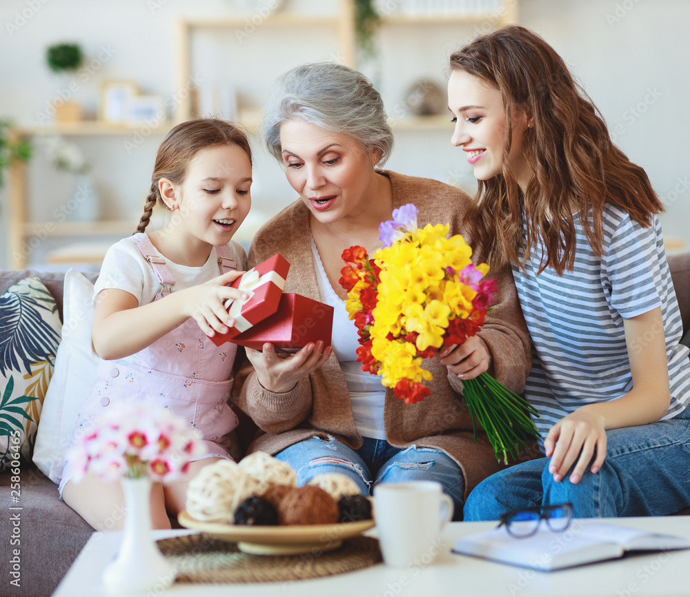 mothers day! three generations of  family mother, grandmother and daughter congratulate on the holi