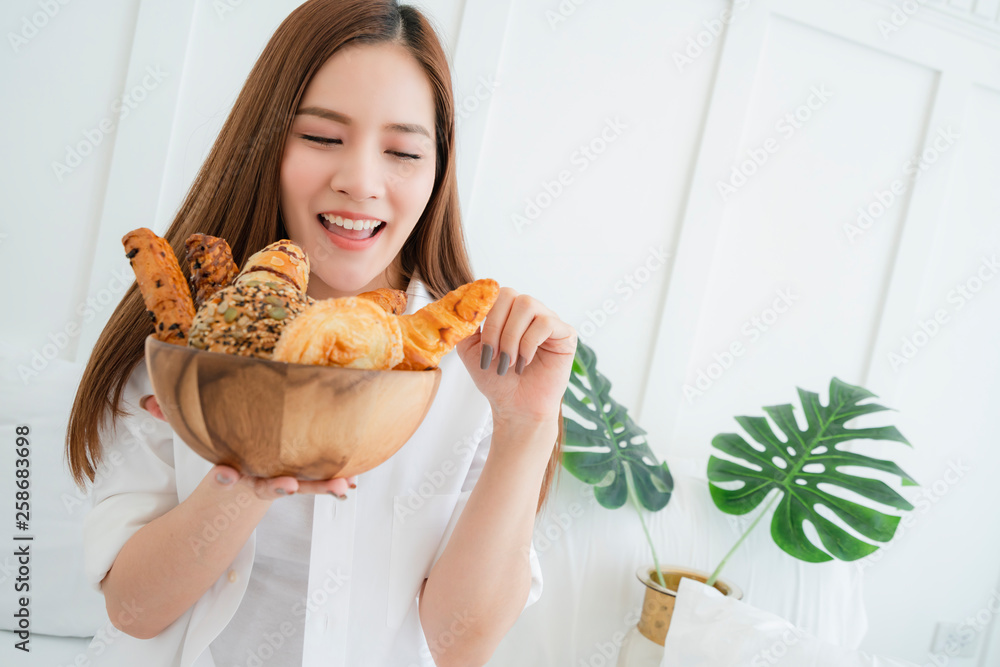 healthy ideas concept portrait of beautiful attractive asian woman hand hold bowl of bread with happ