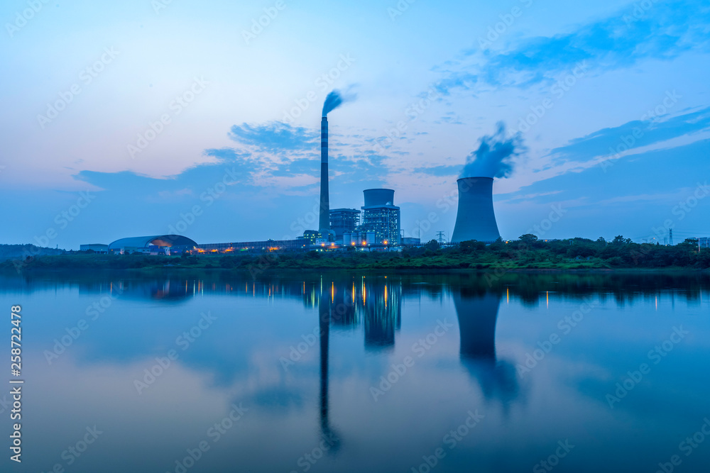 At dusk, the thermal power plants , tops of cooling towers of atomic power plant