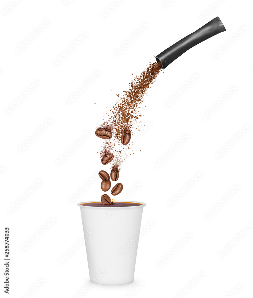 Freeze dried instant coffee pours from the packaging in a mug. Conceptual image on a white backgroun