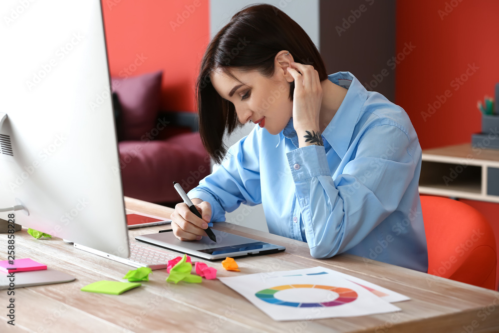 Female designer working in office