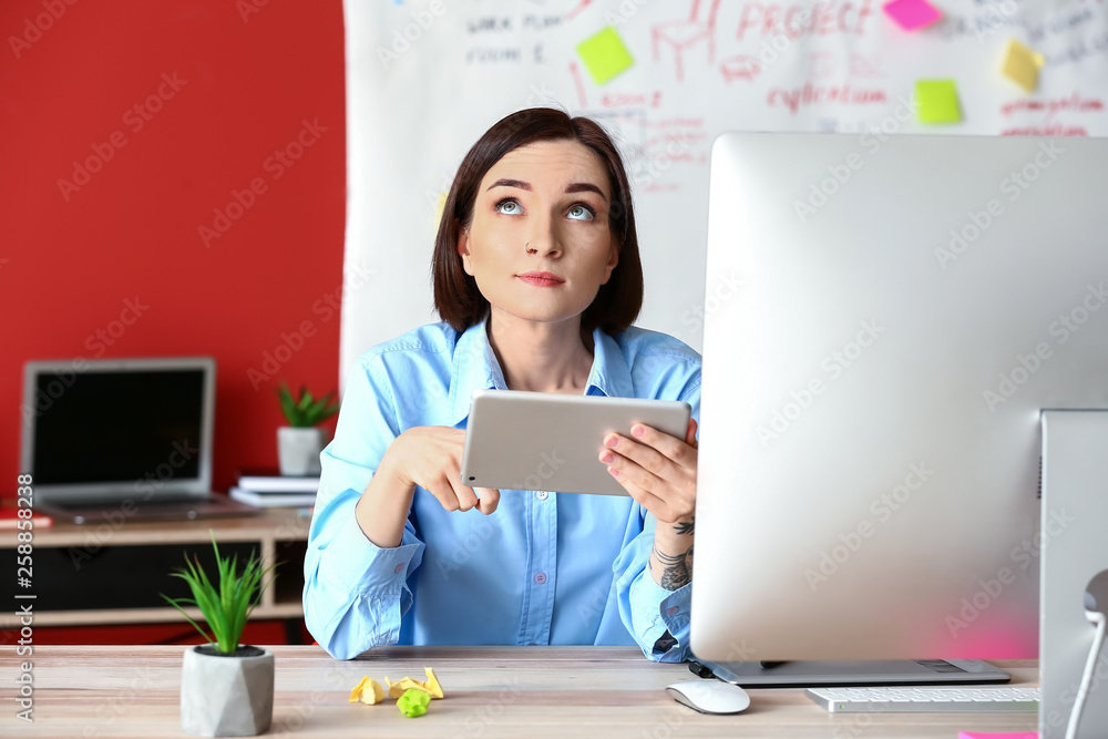 Female designer working in office