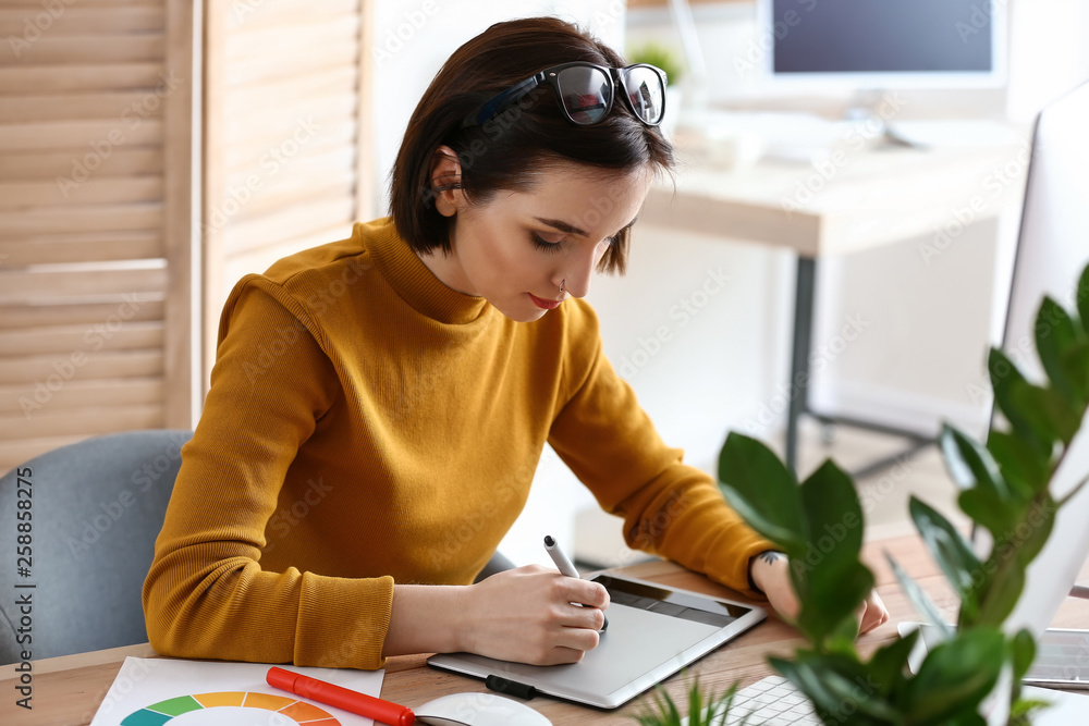 Female designer working in office