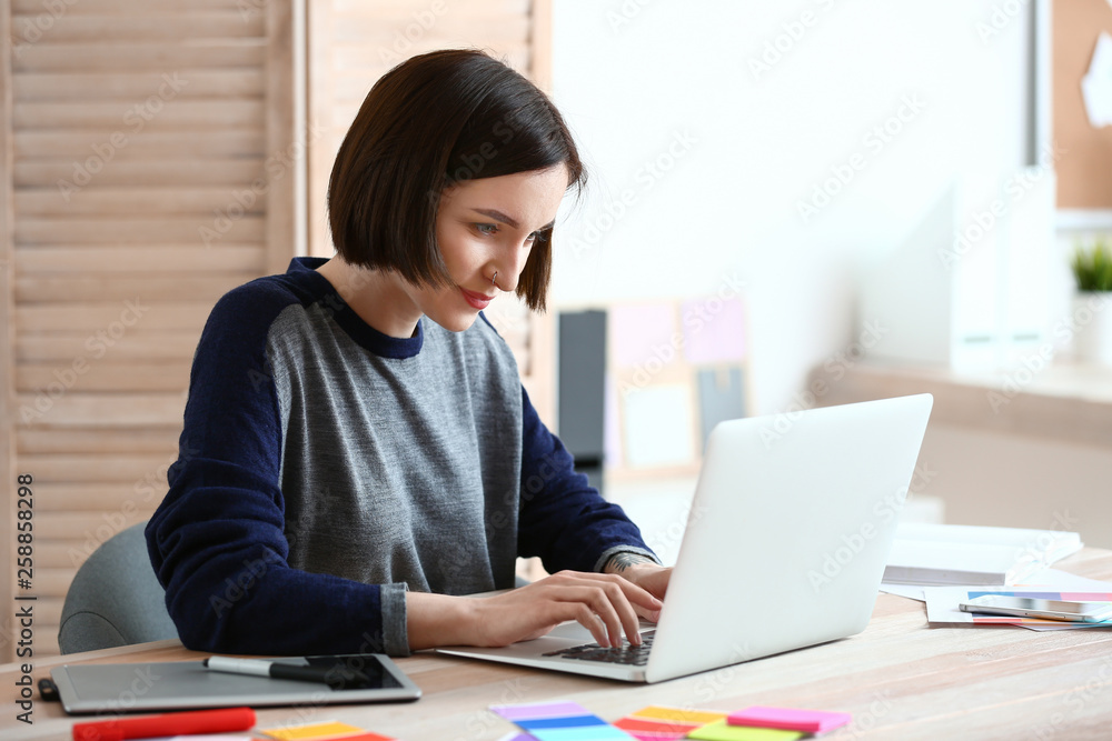 Female designer working in office