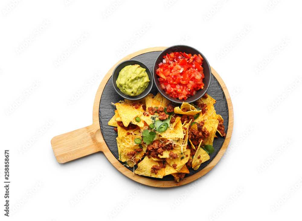 Board with tasty nachos, meat and sauces on white background