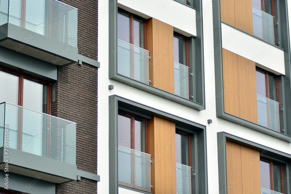 Fragment of a modern apartment building in front. Very modern apartment house.